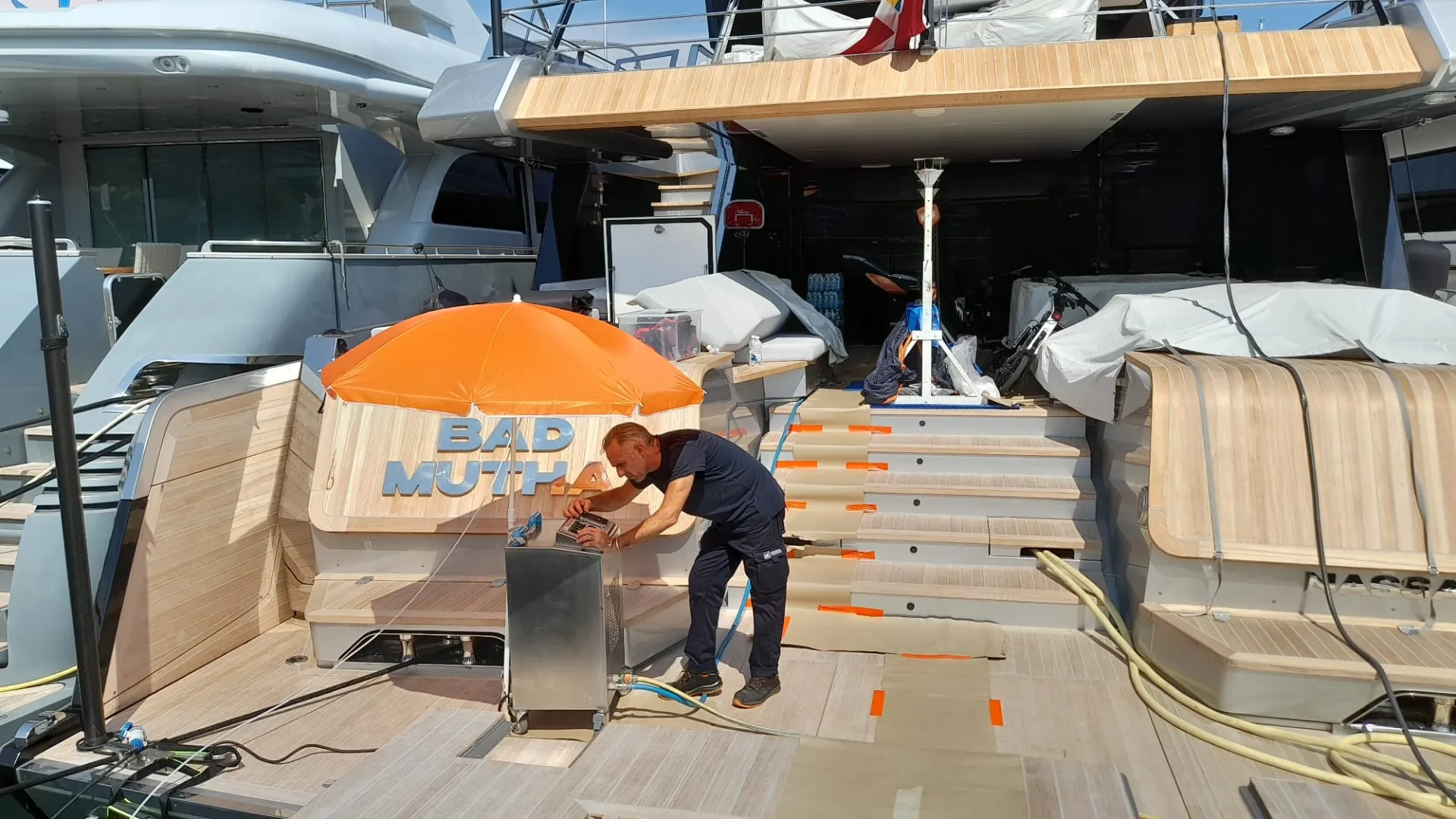 AirBio Marine technician at work on a protected teak aft deck