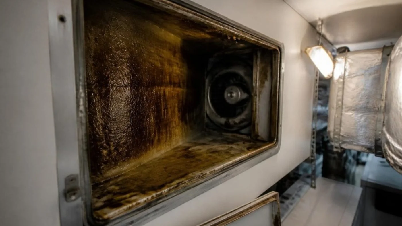Grease film inside a yacht galley extraction duct