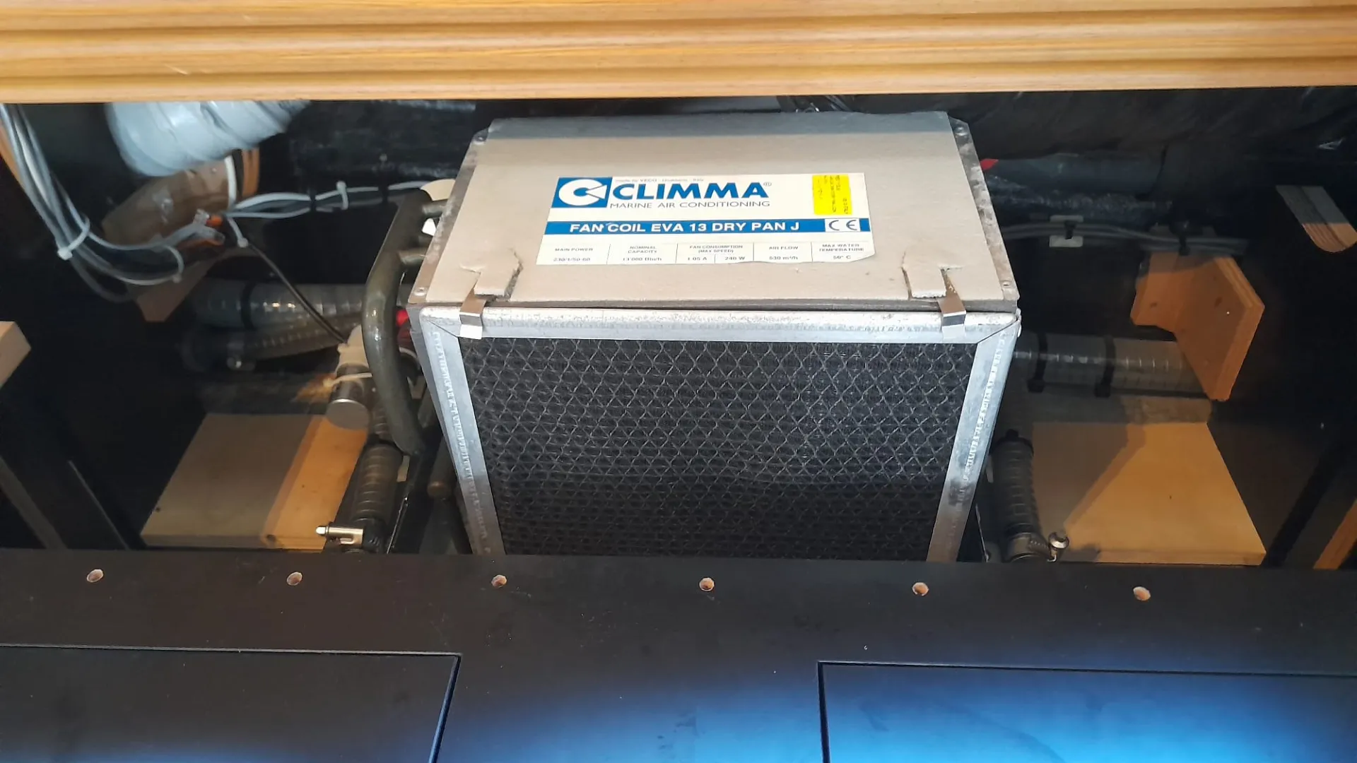 Yacht fan coil unit accessed from the cabin floor for technical cleaning